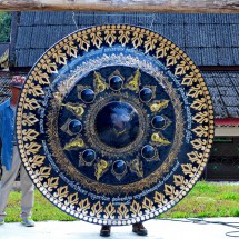 Large gong on the temple outside of the cave